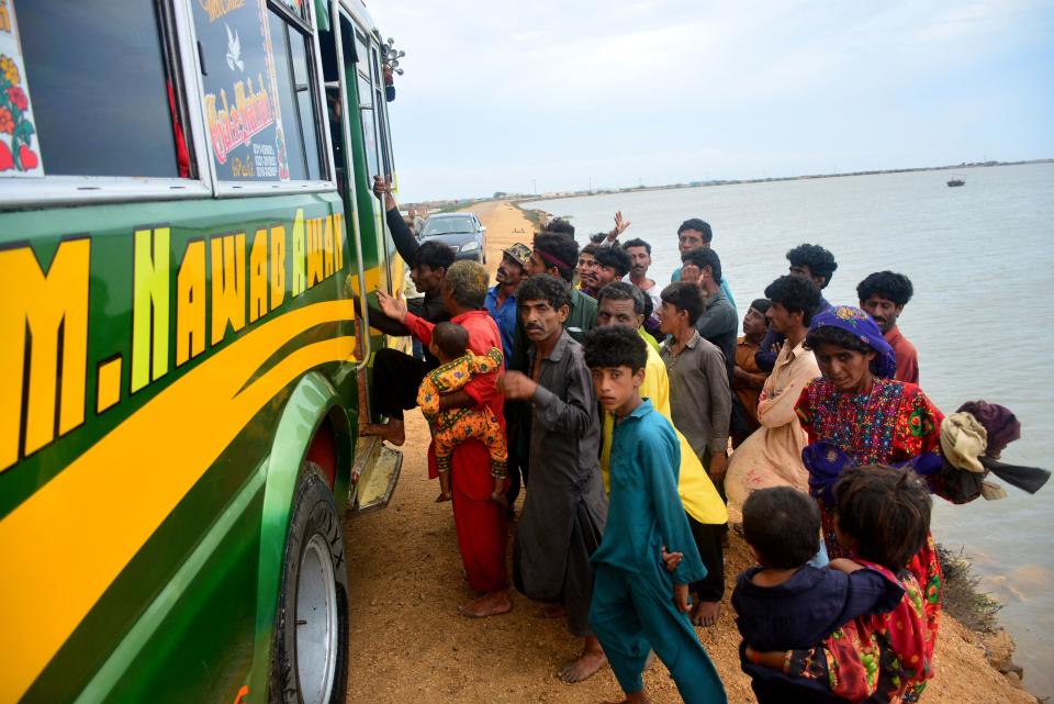 Residents evacuate from a coastal area of Keti Bandar before the due onset of cyclone Biparjoy, in Thatta district of Pakistan’s Sindh (AFP via Getty Images)