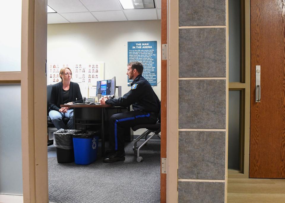 Police Chief Jon Thum talks about scheduling with Sergeant Jessica Speckmeier in Law Enforcement Center on Thursday, August 18, 2022, in Sioux Falls.