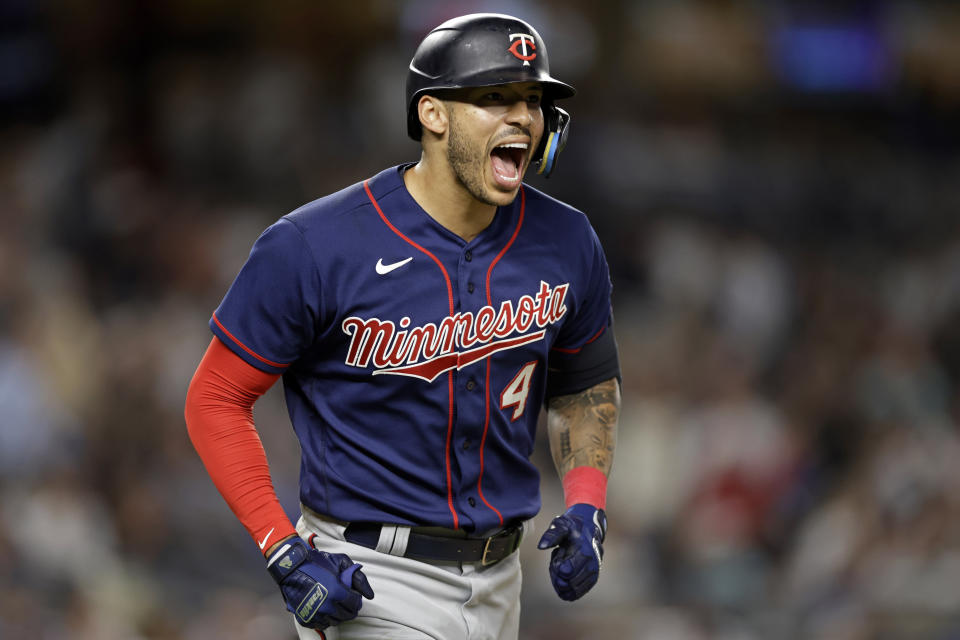 FILE - Minnesota Twins' Carlos Correa reacts after hitting a two-run home run against the New York Yankees during the eighth inning of a baseball game Thursday, Sept. 8, 2022, in New York. In a wild twist overnight, Carlos Correa agreed to a $315 million, 12-year contract with the free-spending New York Mets after his pending deal with the San Francisco Giants came apart over an issue with his physical. (AP Photo/Adam Hunger, File)