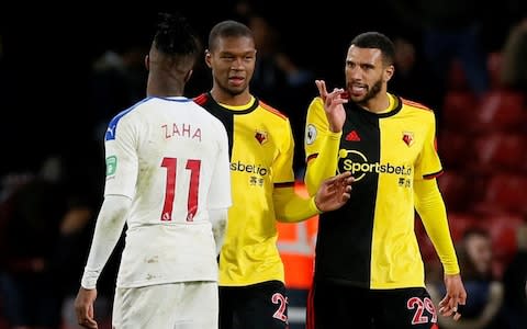 Etienne Capoue  and Christian Kabasele clash with Crystal Palace's Wilfried Zaha - Credit: DAVID KLEIN/REUTERS