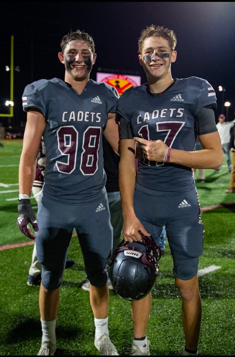 Mac Kromenhoek (left) with his brother, Luke, after Benedictine's win over defending state champion Marist in the 2021 GHSA Class 4A quarterfinals.
