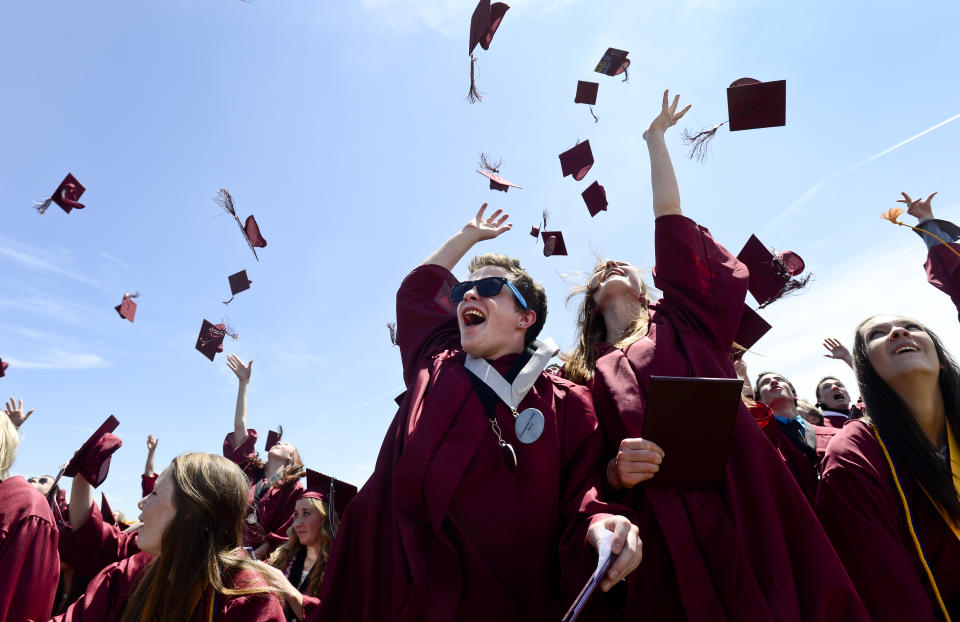 Silver Creek graduates toss their caps in the air after receiving their diplomas, Saturday, May 25, 2013, at Silver Creek High School.(Photo by Matt Jonas/Digital First Media/Boulder Daily Camera via Getty Images)