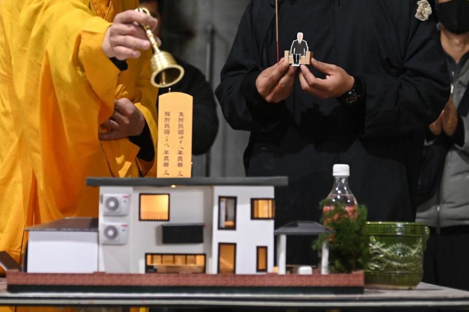 A paper model of a villa, used as an offering for the dead during a ceremony in New Taipei City, Taiwan. <a href="https://www.gettyimages.com/detail/news-photo/this-picture-taken-on-march-16-2019-shows-a-relative-news-photo/1134772913?adppopup=true" rel="nofollow noopener" target="_blank" data-ylk="slk:Sam Yeh/AFP via Getty Images;elm:context_link;itc:0;sec:content-canvas" class="link ">Sam Yeh/AFP via Getty Images</a>