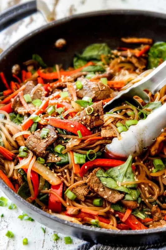 <p>Carlsbad Cravings</p><p>Korean Spicy Noodles are a glass noodle stir fry loaded with tender beef, mushrooms, carrots, onions and bell peppers all bathed in a spicy sauce made with soy, ginger, garlic, sesame and gochujang.</p><p><strong>Get the recipe: <a href="https://carlsbadcravings.com/korean-spicy-noodles/" rel="nofollow noopener" target="_blank" data-ylk="slk:Korean Spicy Noodles;elm:context_link;itc:0;sec:content-canvas" class="link ">Korean Spicy Noodles</a></strong></p>