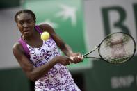 Venus Williams returns to Sloane Stephens during the women's first round at the Roland Garros 2015 French Tennis Open in Paris on May 25, 2015