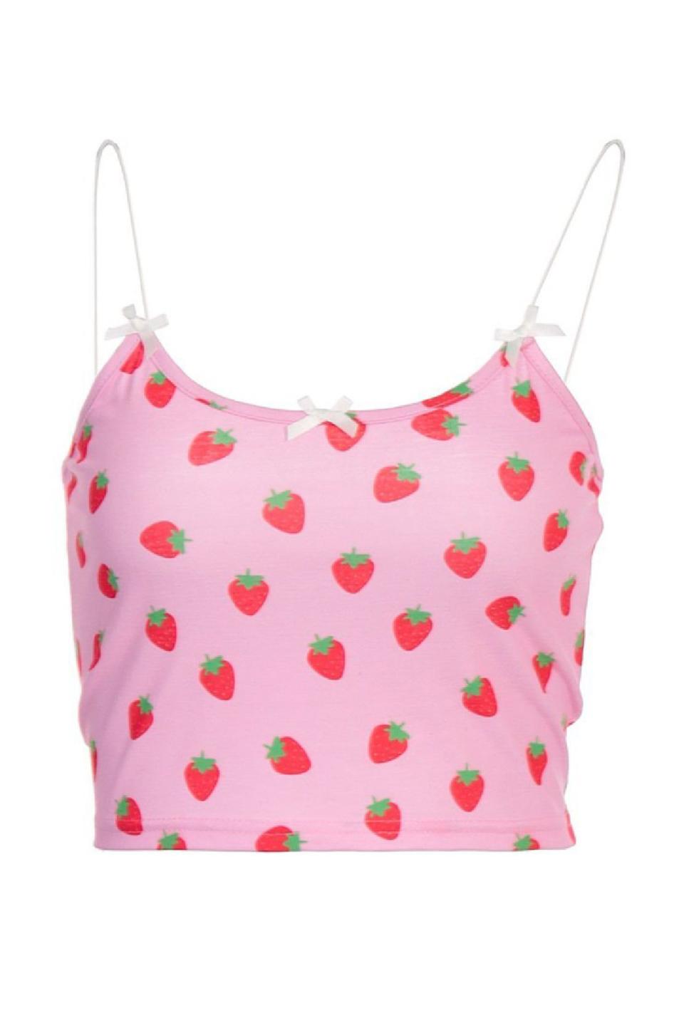 <p><a href="https://go.redirectingat.com?id=74968X1596630&url=https%3A%2F%2Fwww.emmiol.com%2Fstrawberry-print-bow-cropped-cami-product66070.html%3Fcurrency%3DUSD%26gclid%3DCj0KCQjwz96WBhC8ARIsAATR251rJ7kByDLMg-q0rTf08K1D_kiavkWn_O_V2L0072SRsqPvpSOMUGUaArf0EALw_wcB&sref=https%3A%2F%2Fwww.seventeen.com%2Ffashion%2Fg40656779%2Fbarbiecore-barbie-pink-fashion-trend%2F" rel="nofollow noopener" target="_blank" data-ylk="slk:Shop Now;elm:context_link;itc:0;sec:content-canvas" class="link ">Shop Now</a></p><p>Strawberry Print Bow Cropped Cami Top</p><p>$13.00</p><p>emmiol.com</p>