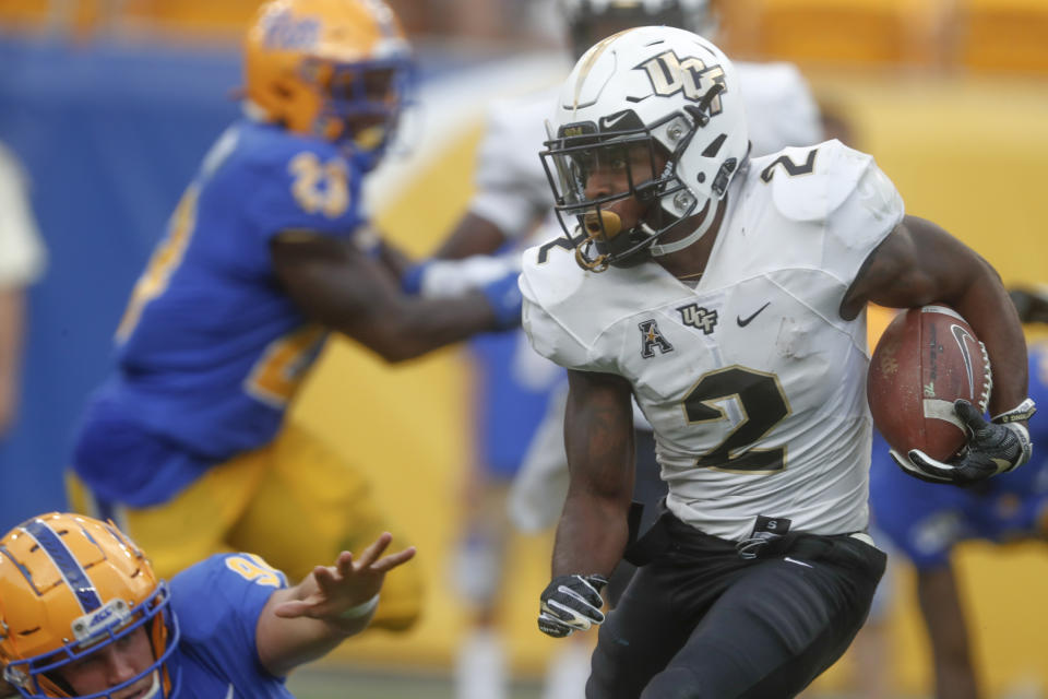 Central Florida' Otis Anderson (2) gets past Pittsburgh's Patrick Jones II (91) on his way to a long punt return for a touchdown during the second half of an NCAA college football game, Saturday, Sept. 21, 2019, in Pittsburgh.(AP Photo/Keith Srakocic)