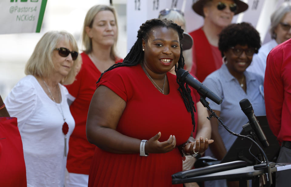 FILE - N.C. Association of Educators President Tamika Walker Kelly speaks during a press conference held by Every Child NC in Raleigh, N.C. Wednesday, Aug. 31, 2022. A local North Carolina judge had the power to transfer large amounts of taxpayer dollars from government coffers to state agencies to carry out a plan to address longstanding education inequities, the state Supreme Court ruled on Friday, Nov. 4. (Ethan Hyman/The News & Observer via AP, File)