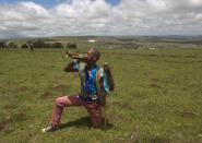 A Zulu man plays a bugle after the funeral of former South African President Nelson Mandela in Qunu, December 15, 2013. REUTERS/Rogan Ward (SOUTH AFRICA - Tags: POLITICS OBITUARY)