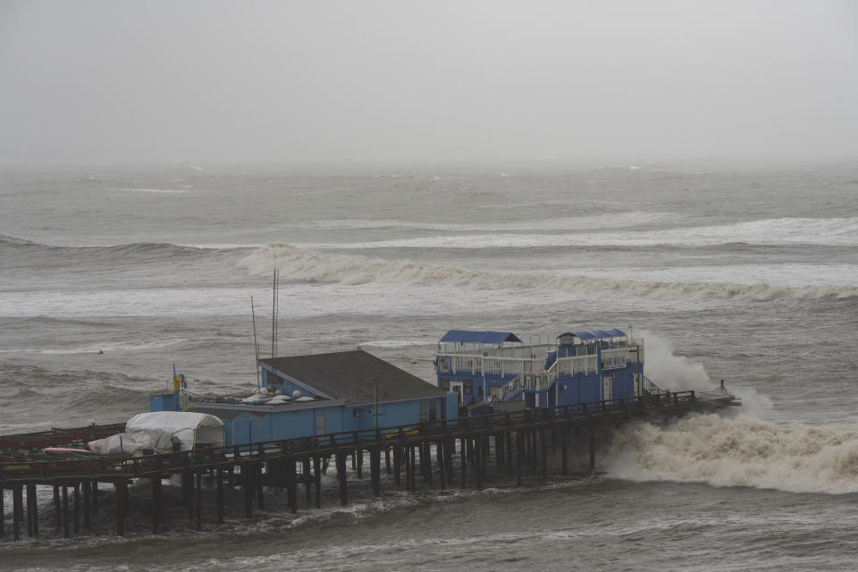 Heavy waves crash over Capitola Wharf in Capitola, Calif., Thursday, Jan. 5, 2023. (AP Photo/Nic Coury)