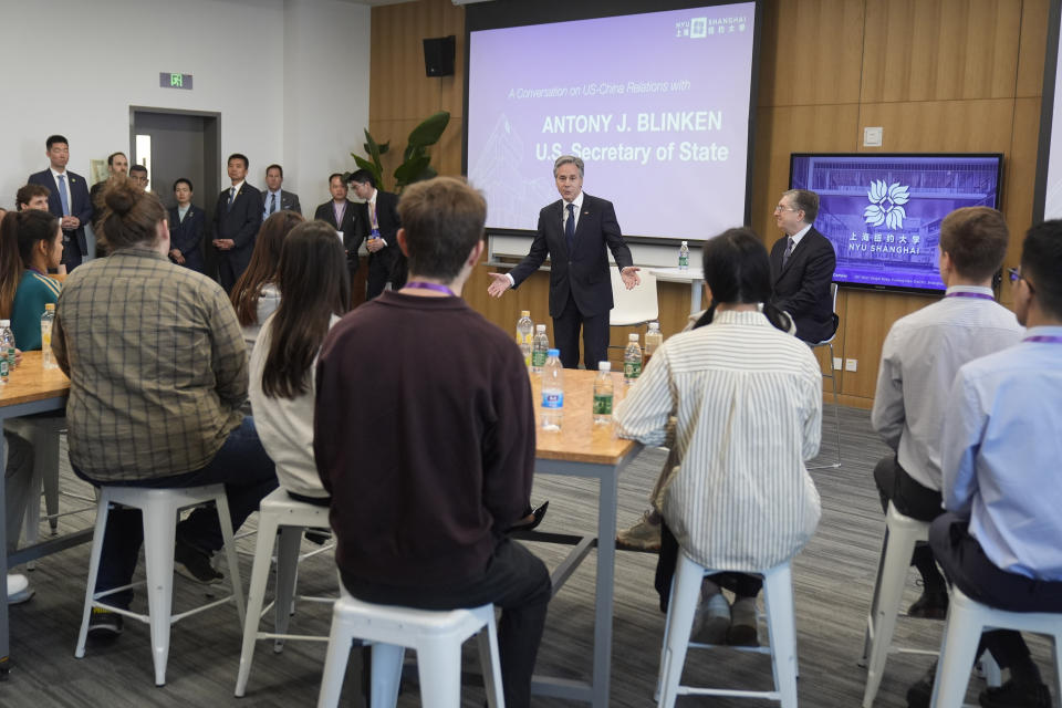 U.S. Secretary of State Antony Blinken, center, with NYU Shanghai Vice Chancellor Jeffrey Lehman, back right, talks to students at NYU Shanghai, Thursday, April 25, 2024, in Shanghai, China. (AP Photo/Mark Schiefelbein, Pool)