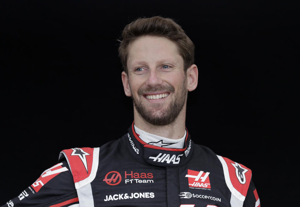 FILE - Haas driver Romain Grosjean, of France, poses for a photo at the Australian Formula One Grand Prix in Melbourne, Australia, in this Thursday, March 12, 2020, file photo. The IndyCar season begins with three new drivers for the season-opener at Barber Motorsports Park. Seven-time NASCAR champion Jimmie Johnson will be a 45-year-old rookie in a class that includes Romain Grosjean from Formula One and V8 Supercars champion Scott McLaughlin. (AP Photo/Rick Rycroft, File)