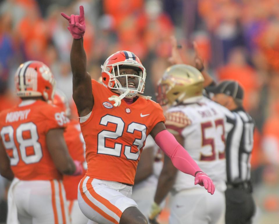 Clemson cornerback Andrew Booth Jr. (23) celebrates after a teammate recovered a fumble for a turnover against Florida State during the fourth quarter Oct 30, 2021; Clemson, South Carolina, USA; at Memorial Stadium. 