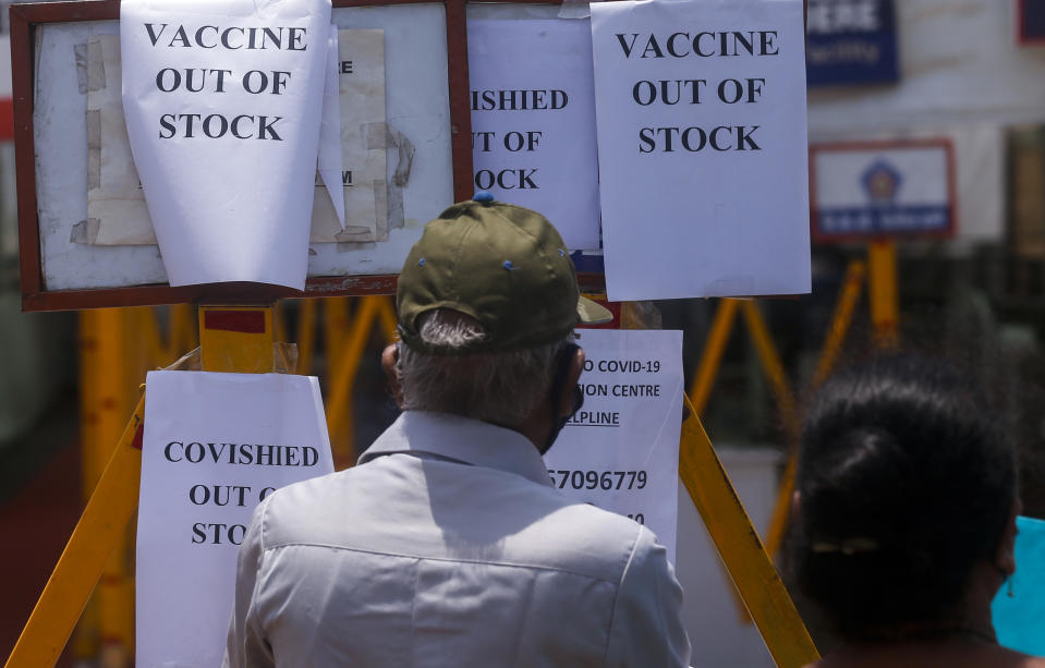 FILE - In this April 20, 2021, file photo, notices informing about the shortage of COVID-19 vaccine is displayed on the gate of a vaccination centre in Mumbai, India. India is battling the world’s fastest pace of spreading infections. Its government has blocked vaccine exports for several months to better meet needs at home, exacerbating the difficulty of poor countries to access vaccine. (AP Photo/Rafiq Maqbool, File)