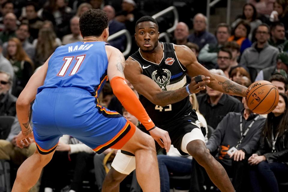 Milwaukee Bucks' Thanasis Antetokounmpo tries to get past Oklahoma City Thunder's Abdel Nader during the second half of an NBA basketball game Friday, Feb. 28, 2020, in Milwaukee. (AP Photo/Morry Gash)