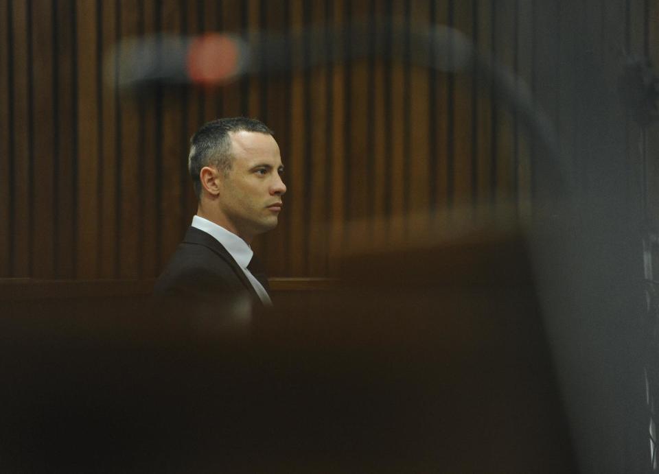 Oscar Pistorius is seated during his murder trial in court in Pretoria, South Africa, Wednesday, May 8, 2014. Pistorius' defense lawyer has called an anesthetist to testify at the runner's murder trial. Pistorius is charged with the shooting death of his girlfriend Reeva Steenkamp on Valentine's Day in 2013. (AP Photo/Werner Beukes, Pool)