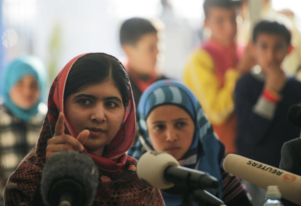 Malala Yousafzai, left, speaks during a press conference at Zaatari refugee camp near the Syrian border, in Mafraq, Jordan, Tuesday, Feb. 18, 2014. A teenage Pakistani activist who came to the international limelight when she was shot by the Taliban said Tuesday that the plight of Syrian refugee children deprived of proper education was a stark reminder of the “dark days” Pakistani children under their hard-line rulers. (AP Photo/Mohammad Hannon)