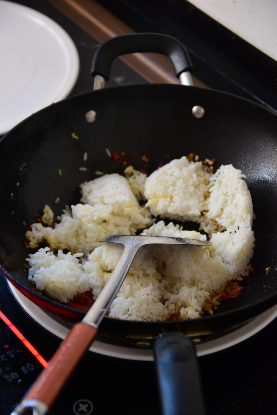 Preparing Chinese fried rice in a wok.