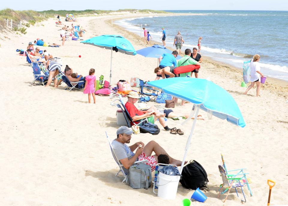 MASHPEE -- Enjoying a warm day at South Cape Beach.