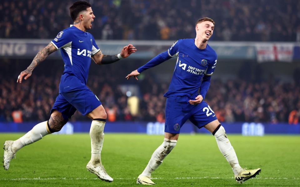 Cole Palmer of Chelsea celebrates scoring their second goal with Enzo Fernandez