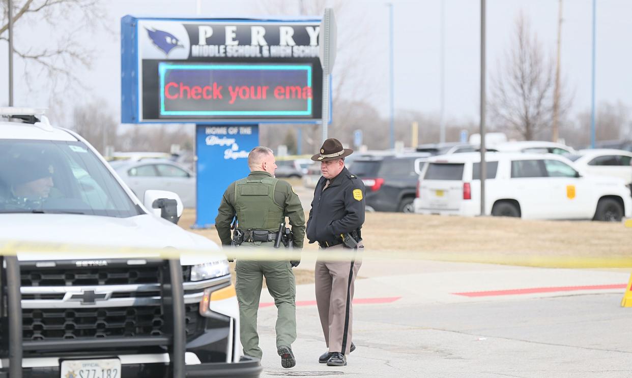 Multiple police departments investigate a shooting at Perry High School on Thursday, Jan. 4, 2024, in Perry, Iowa.