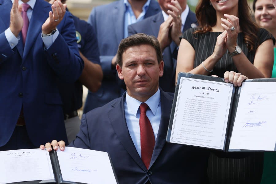 Two lawsuits accuse Gov. Ron DeSantis (pictured) and other Republicans of violating Black Floridians’ voting rights. Above, DeSantis is seen in June 2021 holding bills he signed unrelated to voting, targeting foreign influence and corporate espionage. (Photo by Joe Raedle/Getty Images)