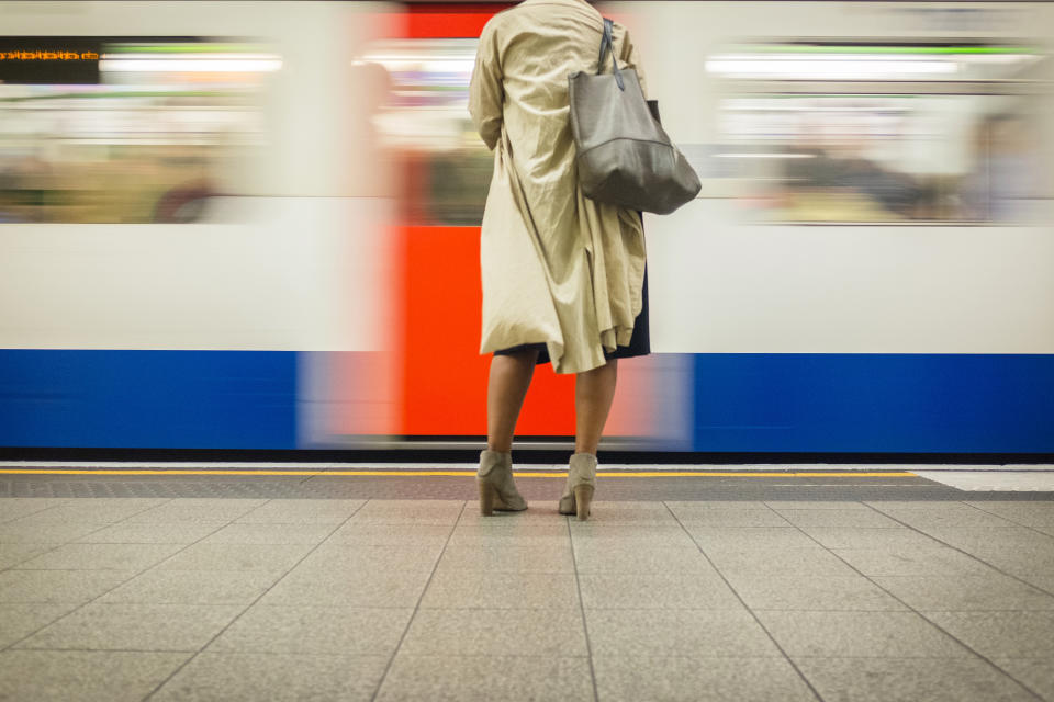 Stock picture of a woman waiting for a train, after news that downblousing is to be made illegal. (Getty Images)