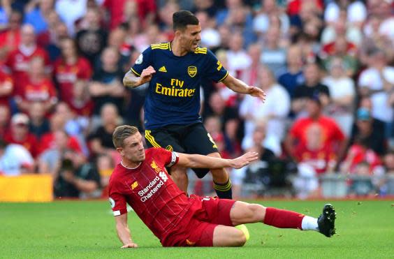 Jordan Henderson captained Liverpool for the 100th time in the Premier League against Arsenal (PA)