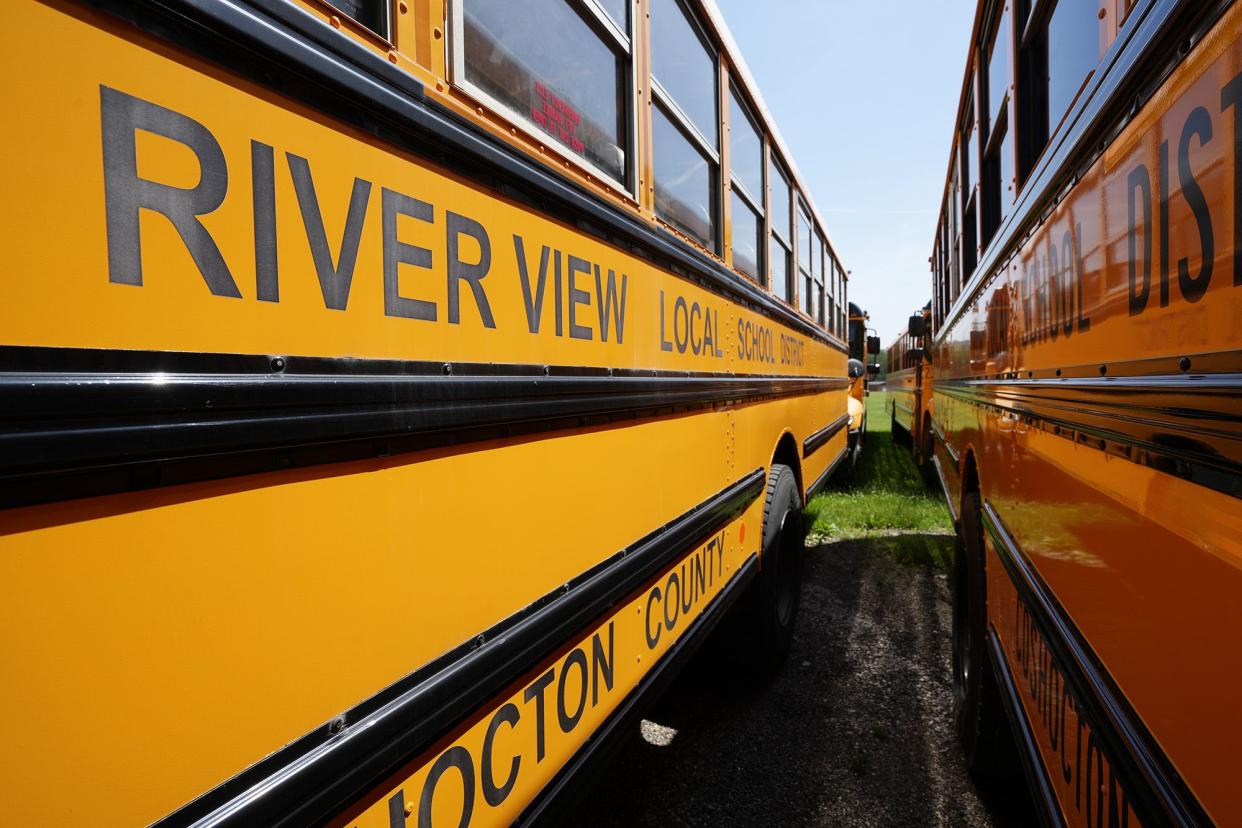 School buses for the River View Local School District in Coshocton County parked near the district administration office in June.