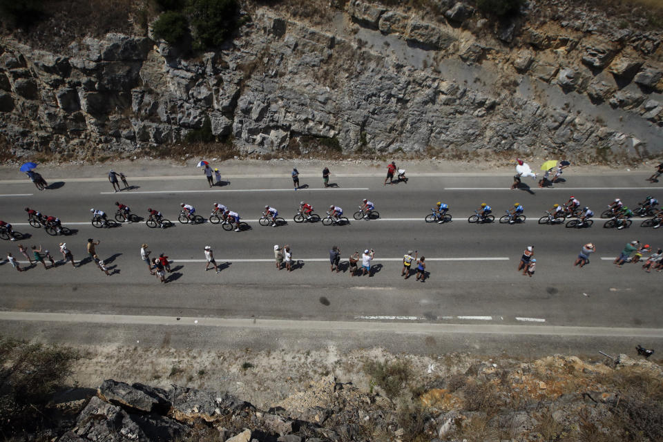 The pack rides during the sixteenth stage of the Tour de France cycling race over 117 kilometers (73 miles) with start and finish in Nimes, France, Tuesday, July 23, 2019. (AP Photo/ Christophe Ena)