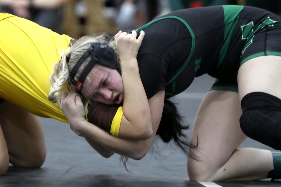 Badin's Rachel Nusky and Brush's Joshika Sherpa compete in their 125-pound match during the OHSWCA Girls State Wrestling Tournament on Feb. 19, 2022, at Hilliard Davidson High School in Hilliard, Ohio.