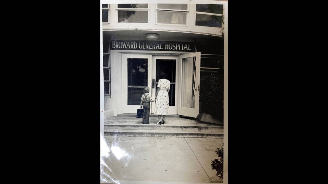 A woman with a young boy in front of Broward General Hospital on April 28, 1953.