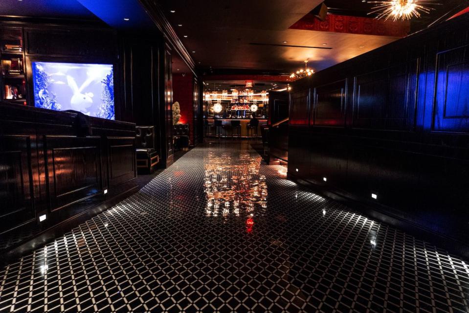 <p>With dim lighting, gold accents, plush sofas, and an ornate DJ booth, the vibe is decidedly over-the-top.</p>