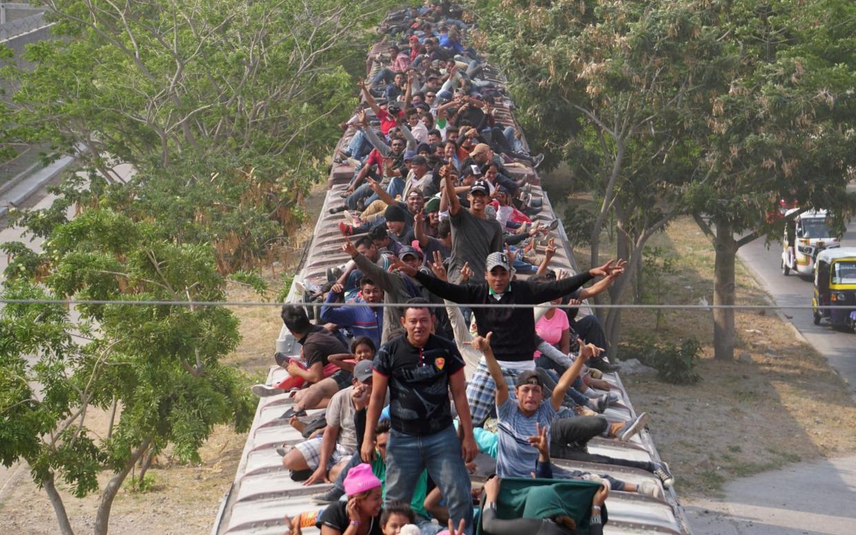 A caravan of migrants moving through Mexico towards the US in late April - REUTERS