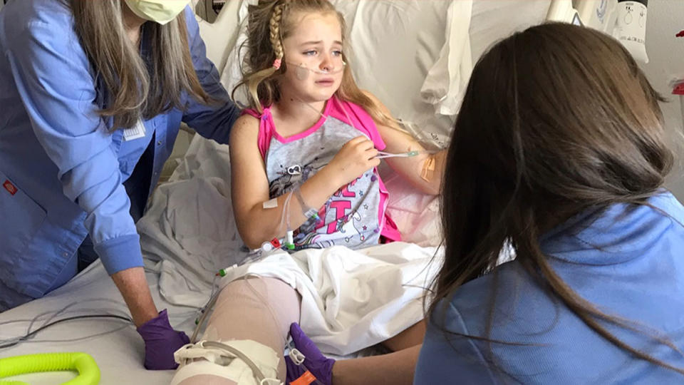 Callaway Lewis in hospital after part of her leg was removed. 