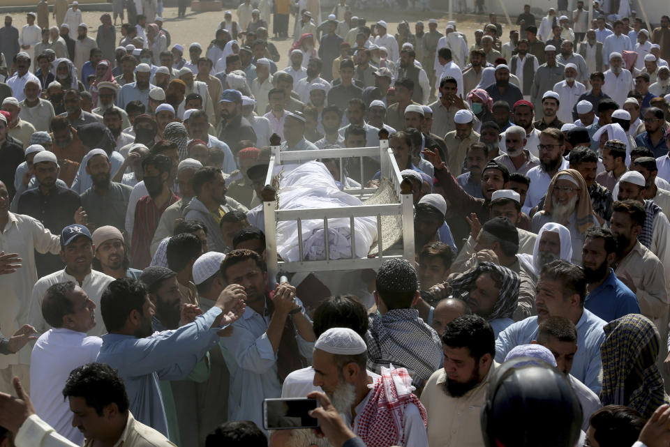 People carry the body of a victim of a toxic gas leak, during his funeral prayer, in Karachi, Pakistan, Monday, Feb. 17, 2020. The toxic gas leak killed several people and sickened dozens of others in a coastal residential area in Pakistan's port city of Karachi, police said Monday. The source of the leak, which occurred on Sunday night, and the type of gas that had leaked were not immediately known. There was no suspicion of sabotage. (AP Photo/Fareed Khan)