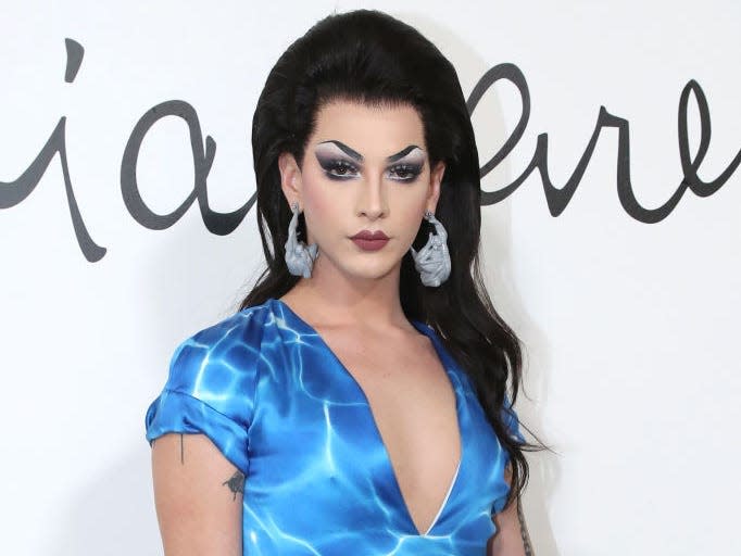 Violet Chachki in black wig and blue dress