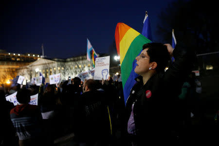 Transgender activists and supporters protest potential changes by the Trump administration in federal guidelines issued to public schools in defense of transgender student rights, near the White House in Washington, U.S. February 22, 2017. REUTERS/Jonathan Ernst