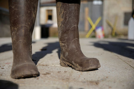 The boots of an opponent to the project of an underground nuclear waste disposal of the French National Radioactive Waste Management Agency ANDRA called CIGEO, who wanted to stay anonymous, are seen during an inverview with Reuters journalists in front of the "house of resistance" in Bure, Eastern France, April 6, 2018. Picture taken April 6, 2018. REUTERS/Vincent Kessler