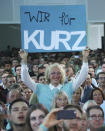 Supporters of former Austrian chancellor and top candidate of the Austrian People's Party, OEVP, Sebastian Kurz react during a party in Vienna, Germany, Sunday, Sept. 29, 2019. (AP Photo/Michael Sohn)