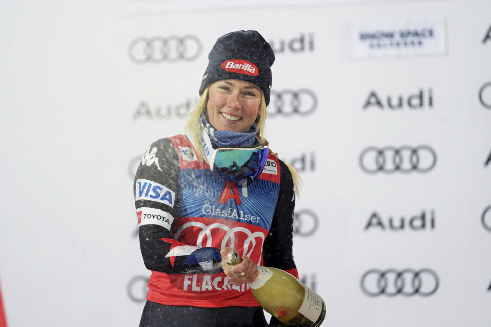 United States' Mikaela Shiffrin celebrates winning an alpine ski, women's World Cup slalom, in Flachau, Austria, Tuesday, Jan.16, 2024. (AP Photo/Giovanni Auletta)