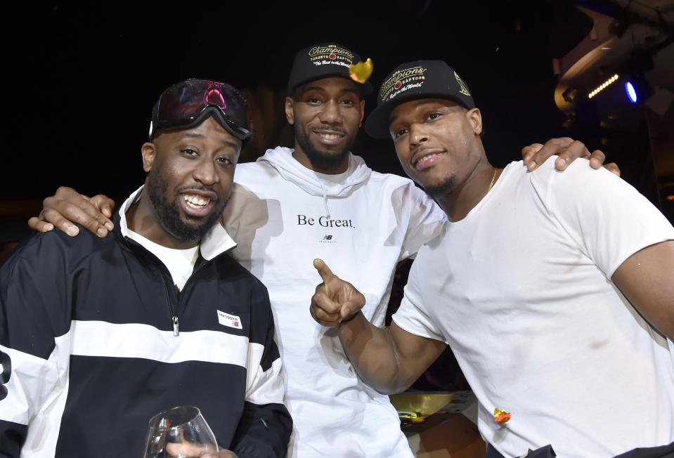 LAS VEGAS, NEVADA - JUNE 14: Kawhi Leonard (C) and Kyle Lowry (R) of the Toronto Raptors celebrate their NBA championship at XS Nightclub at Wynn Las Vegas on June 14, 2019 in Las Vegas, Nevada. (Photo by David Becker/Getty Images for Wynn Las Vegas)