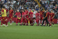 Roma's Evan Ndicka is carried off the pitch during the Serie A soccer match between Udinese and Roma at the Bluenergy Stadium in Udine, Italy, Sunday, April 14, 2024. Roma defender Evan Ndicka has collapsed toward the end of his team’s Serie A match at Udinese with the game then called off. The score was 1-1 when Ndicka fell to the ground in the 71st minute while the action was at the other end of the field and started pointing at his chest. (Andrea Bressanutti/LaPresse via AP)