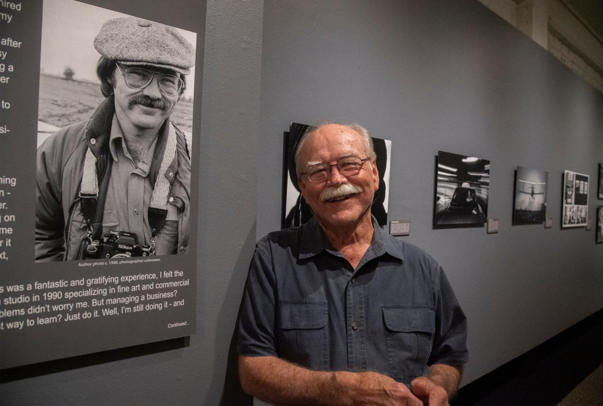 Local photographer Rich Turner among some of his photos in an exhibition of his work at The Haggin Museum in Stockton on April 14, 2021.