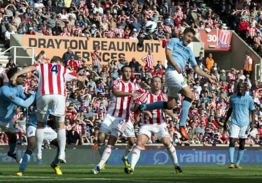 Manchester City's Javi Garcia (2nd R) heads the ball to score against Stoke City during their Premiership football match at The Brittania Stadium in Stoke. Garcia rescued the Premier League champions as his debut goal earned a 1-1 draw at Stoke