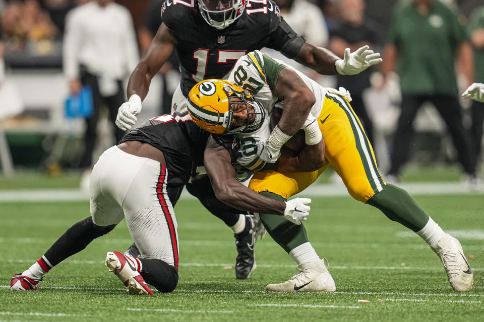 Sep 17, 2023; Atlanta, Georgia, USA; Green Bay Packers running back AJ Dillon (28) is tackled by <a class="link " href="https://sports.yahoo.com/nfl/teams/atlanta/" data-i13n="sec:content-canvas;subsec:anchor_text;elm:context_link" data-ylk="slk:Atlanta Falcons;sec:content-canvas;subsec:anchor_text;elm:context_link;itc:0">Atlanta Falcons</a> safety <a class="link " href="https://sports.yahoo.com/nfl/players/33428" data-i13n="sec:content-canvas;subsec:anchor_text;elm:context_link" data-ylk="slk:Richie Grant;sec:content-canvas;subsec:anchor_text;elm:context_link;itc:0">Richie Grant</a> (27) during the second half at Mercedes-Benz Stadium. Mandatory Credit: Dale Zanine-USA TODAY Sports