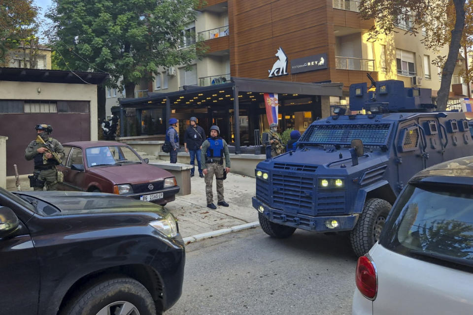 Kosovo police officers search restaurant and building in northern Serb-dominated part of ethnically divided town of Mitrovica, Kosovo, Friday, Sept. 29, 2023. In one of the worst confrontations since Kosovo declared independence from Serbia in 2008, about 30 masked men opened fire on a police patrol near the village of Banjska early Sunday. One Kosovo police officer and three gunmen were killed in Sunday's shootout between Serb insurgents and Kosovo police. (AP Photo/Radul Radovanovic)