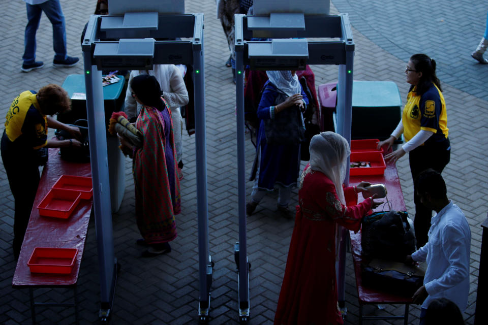 Muslim women pass through security as Muslims gather for the celebration of the Eid al-Fitr holiday, the end of the holy month of Ramadan at Angel Stadium of Anaheim in Anaheim, California, U.S., June 25, 2017.&nbsp;