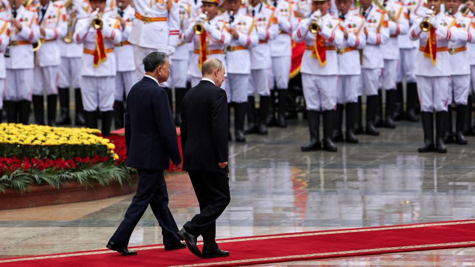 Russia's President Vladimir Putin participates in a welcome ceremony hosted by Vietnam's President To Lam, at the Presidential Palace in Hanoi on June 20, 2024. - Athit Perawongmetha/Reuters