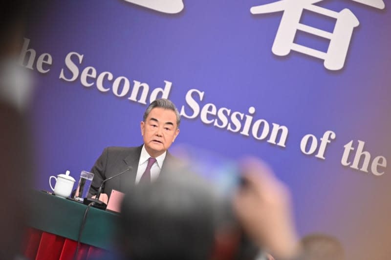 Wang Yi, China's Foreign Minister, speaks during a press conference at the National People's Congress (NPC).  Johannes Neudecker/dpa